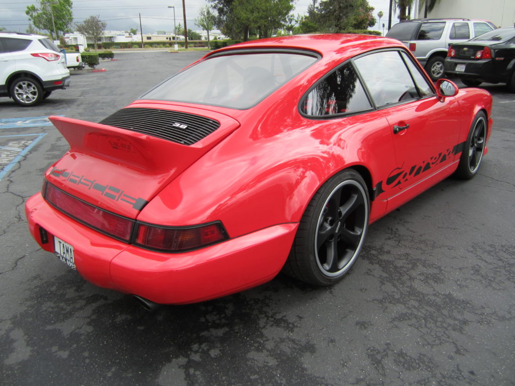 On the back of the car, a custom duck wing spoiler was installed to help with the aerodynamics of the vehicle.