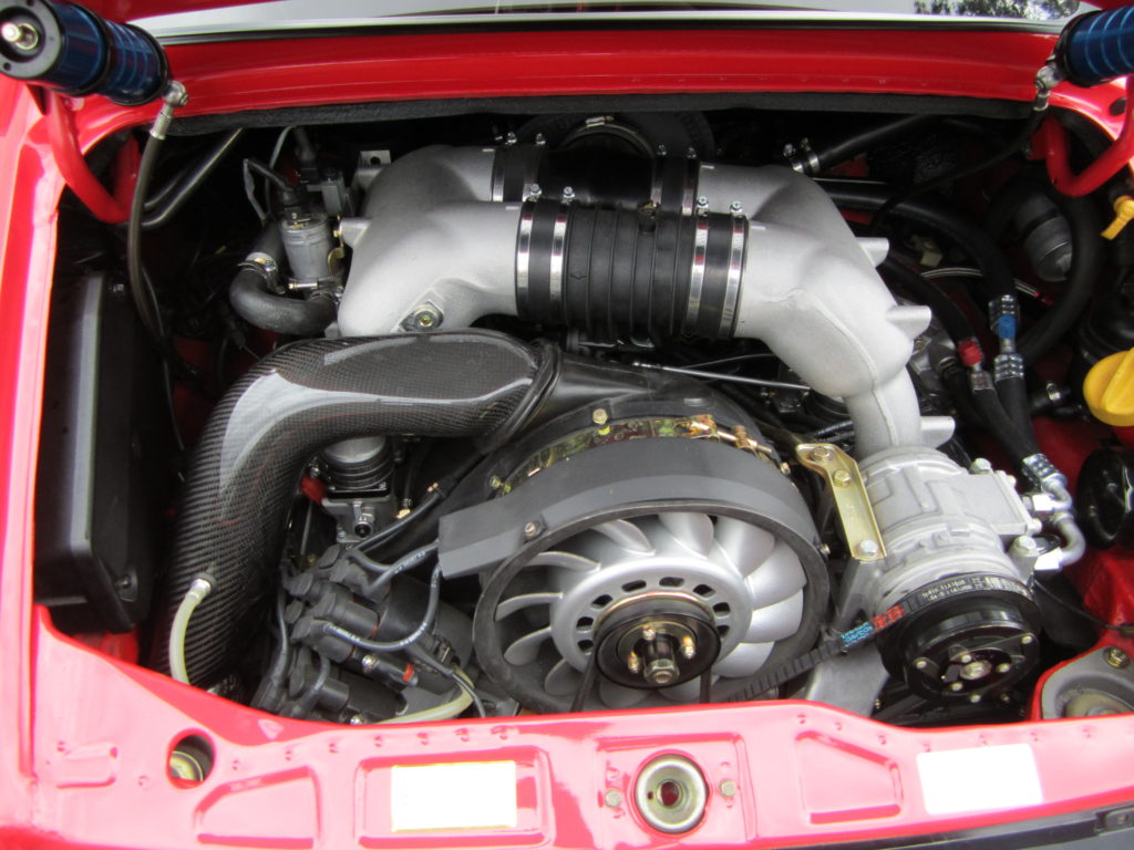 An upgraded engine for a 1989 Porsche 964 that is putting out around 350 horsepower.